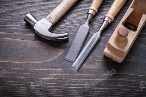 Preview: Claw Hammer Shaving Plane And Flat Chisels On Vintage Wooden Board Construction Concept.