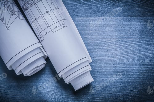 Preview: White Rolled Blueprints On Painted Board.