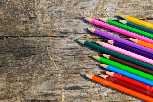 Preview: Colored Pencils On Old Wooden Background