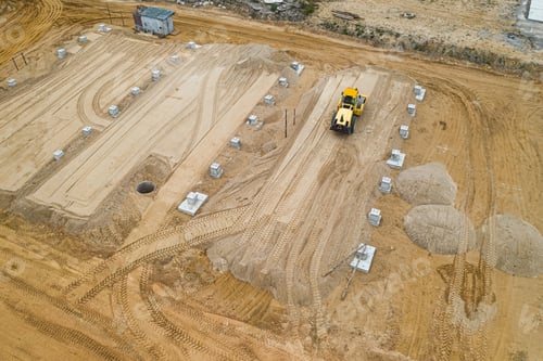 Preview: Tractor Roller Ramming The Ground For A Construction Site Top View.