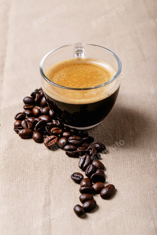 Preview: Fresh Coffee In Glass Cups With Cinnamon Over Brown Cloth Background. Top View, Flat Lay