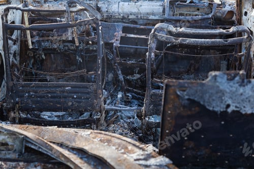 Preview: Burned Down Car, Abstract Background, Selective Focus. The Situation Of Protests And Pogroms In The