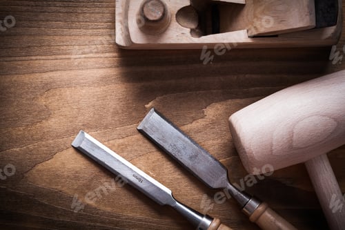 Preview: Wooden Mallet Shaving Plane Firmer Chisels On Wood Board Construction Concept.