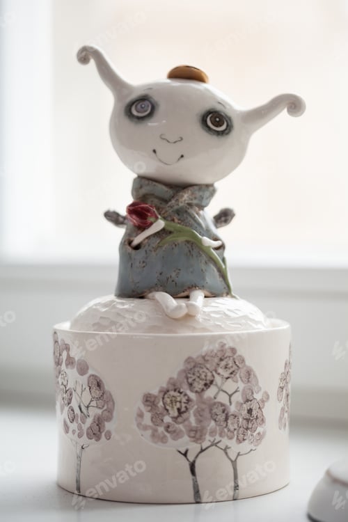 Preview: Whimsical Ceramic Figure with Flower