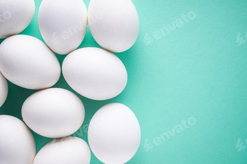 Preview: White Chicken Eggs On Green Pastel Background