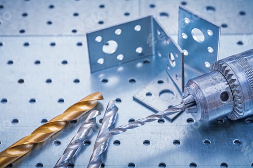 Preview: Drill With Metal Boring Bits And Drilled Angle Bars On Perforated Metallic Background Construction