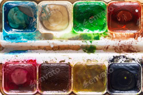 Preview: Used Watercolor Paint Close-Up. Creativity Symbol. The Concept Of A Completed Project.