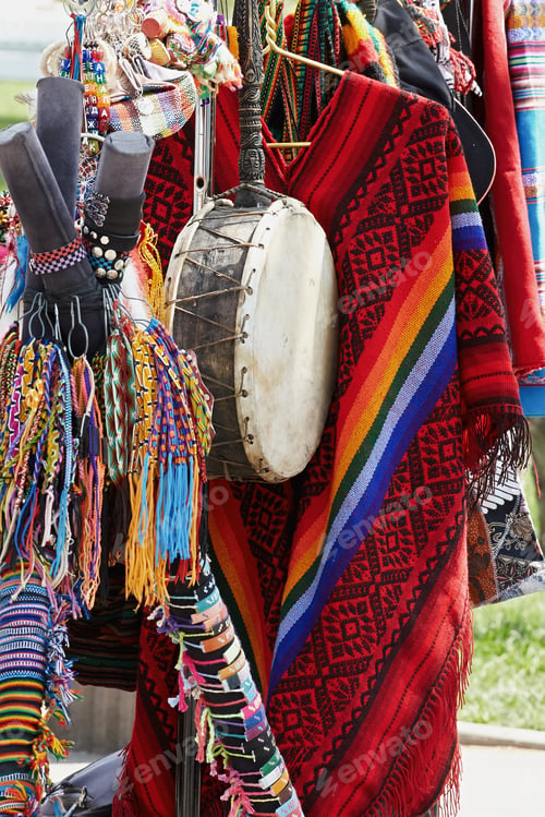 Preview: A Closeup Indian Ethnic Leather Drum On The Background Of Beautiful Colored Fabrics And Ornaments