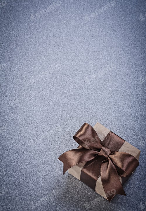 Preview: Boxed Present In Brown Paper On Grey Background Celebrations Concept.