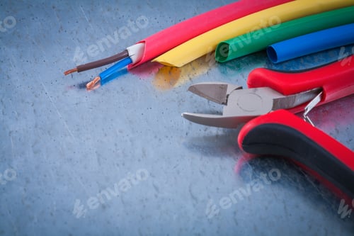 Preview: Wire Protection Copper Cables Metal Nippers On Scratched Metallic Surface.