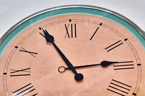 Preview: Large Wall Clock Close-Up. Roman Numeral Dial In Retro Style.. Green And Beige Color Of The Clock