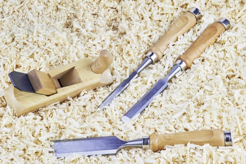 Preview: Three Chisels And One Spokeshave Lying In Wooden Shavings