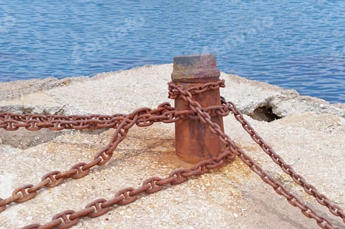 Preview: Rusted Mooring Bollard With Chain On The Berth