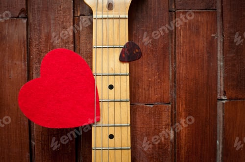 Preview: Guitar Neck With Red Heart On Wooden Background