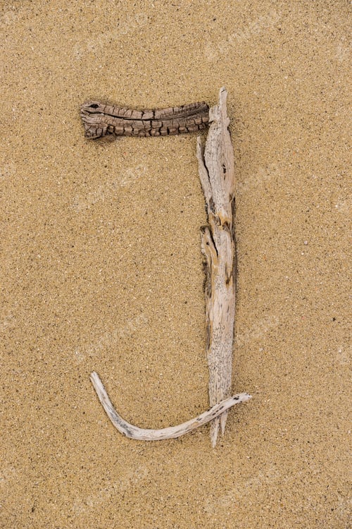 Preview: Sand Beach Letters Alphabet, Letter J Written With Driftwood.