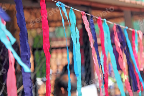 Preview: Bright Colored Ribbons Hang And Flutter In The Wind. Fair Holiday Festival Decoration. India, Goa