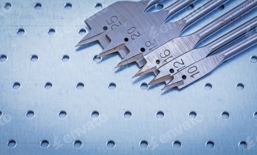 Preview: Spade Bits For Drilling Wood On Perforated Metal Sheet Construction Concept.