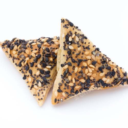 Preview: Crisps With Nuts And Seeds Stacked On A White Background.
