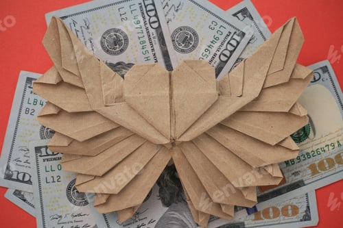 Preview: Origami Paper Heart Mockup. Selective Focus. Against The Background Of Dollars.