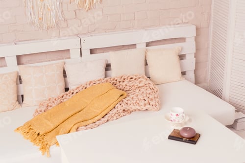 Preview: Cozy Interior with Pillows, Blankets, and Decorations