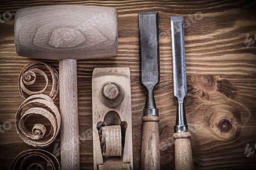 Preview: Lump Hammer Shaving Plane Firmer Chisels Planning Chips On Vintage Wood Board Construction Concept.