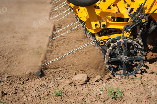Preview: Farmer In Tractor Preparing Farmland With Seedbed For The Next Year