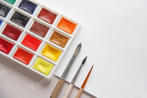 Preview: Watercolor Paints and Brushes on White Surface