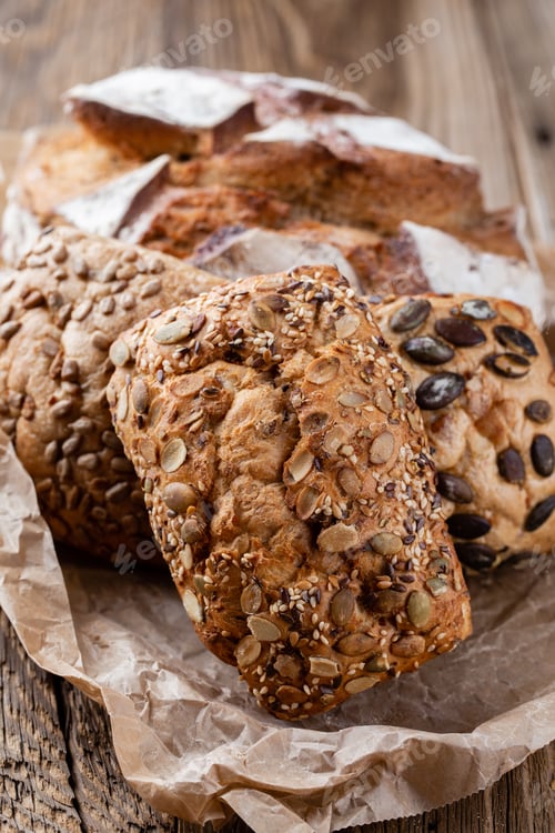 Preview: Bread Background, Top View Of, Black And Rye Loaves On Black.