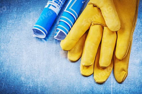 Preview: Safety Gloves Blue Construction Drawings On Scratched Metallic Background.