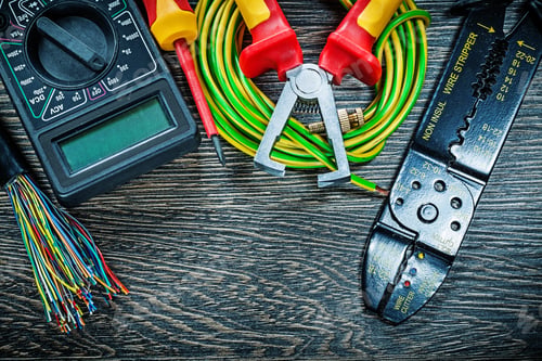 Preview: Electric Wires Tester Screwdriver Rolled Cable Insulation Strippers Voltmeter On Wooden Board.