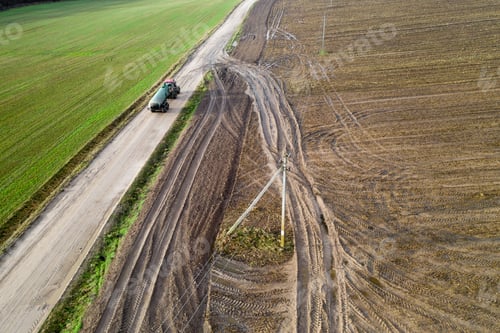 Preview: Tractor Carrying Organic Fertilizer Top View From Drone.