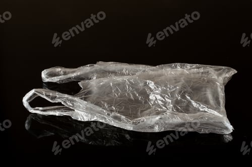 Preview: White Plastic Bag Isolated On Dark Background