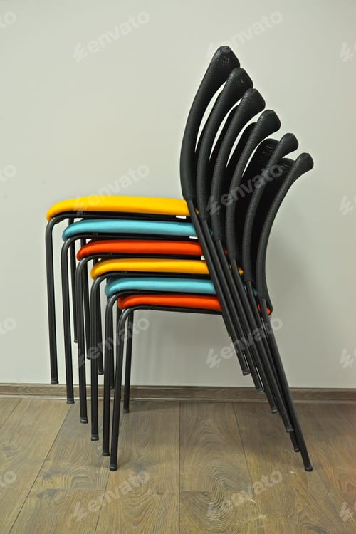 Preview: Office Chairs Are Put With Color Seats In A Stack. Side View