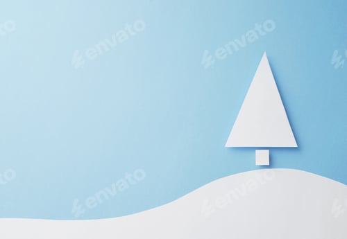Preview: Paper Christmas Tree Cut From White Paper Over Blue Background, Top View