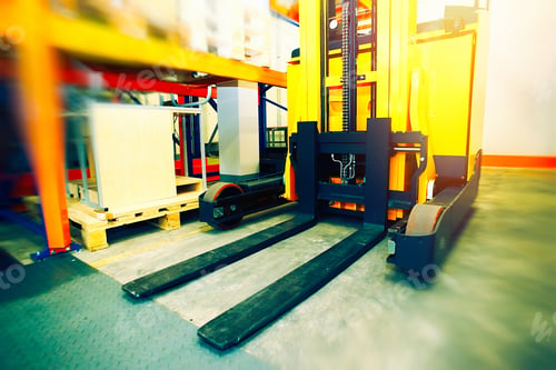Preview: Shelves, Racks And Forklift Blurred And Toned With Pallets In Distribution Warehouse Interior