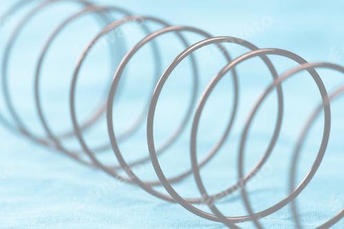 Preview: Details Of A Metal Spring On Blue Cloth.