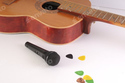 Preview: Guitar And Microphone On A White Background