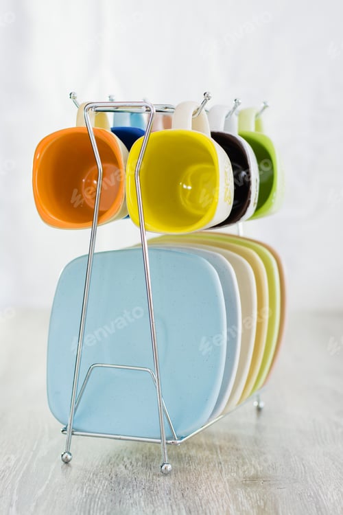 Preview: Set Of Coffee Cups And Saucers On A Metal Stand On The Table