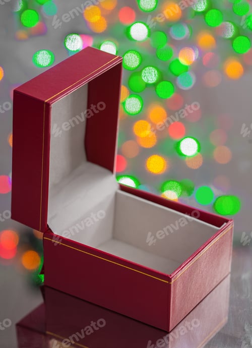 Preview: Opened Red Gift Box On Surface Of Miror