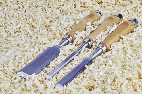 Preview: Three Chisels Of Various Widths Lying In Wooden Shavings