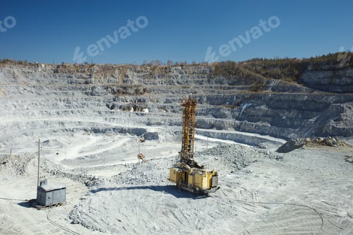 Preview: Mining Drilling Rig On The Background Of A Large Stone Quarry. Mining Machinery.