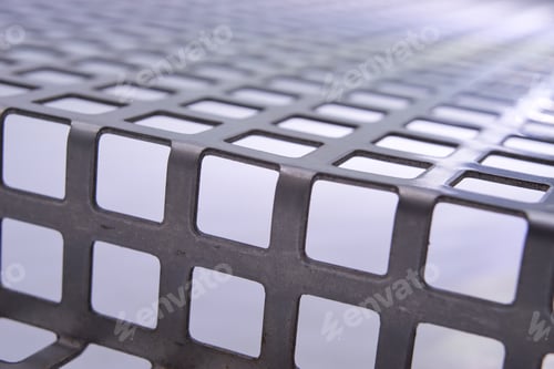 Preview: Perforated Stainless Metal Sheet On White Background.