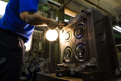 Preview: Metalworking Machine. A Heavy Industrial Worker Performs A Mechanical Operation On A Machine For