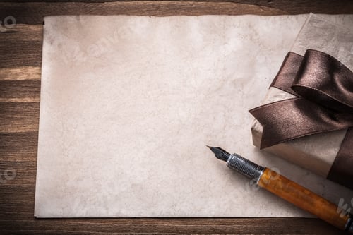 Preview: Present Box Tied Bow Paper Fountain Pen On Wood Board.