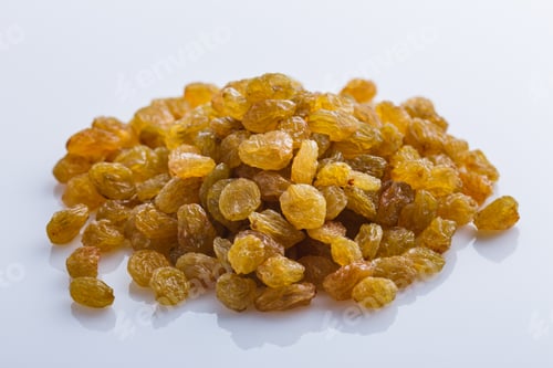 Preview: Golden Raisins On A White Acrylic Background