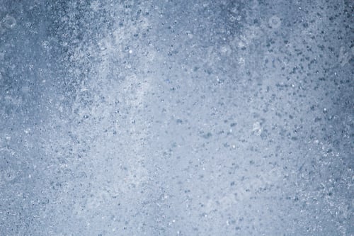 Preview: Splashes And Drops Of Water In A City Fountain Urban Environment. Toned Background