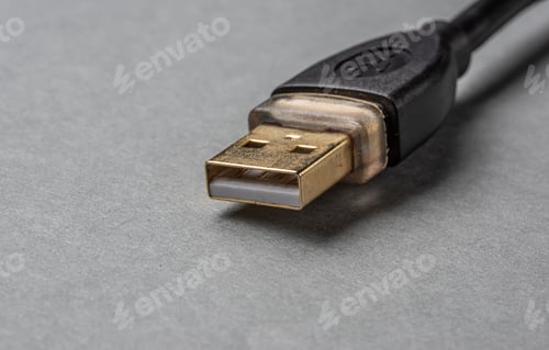 Preview: Gold Usb-Plug On Grey Background