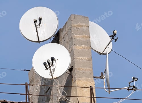 Preview: Old Satellite Dishes On The Roof Of The House