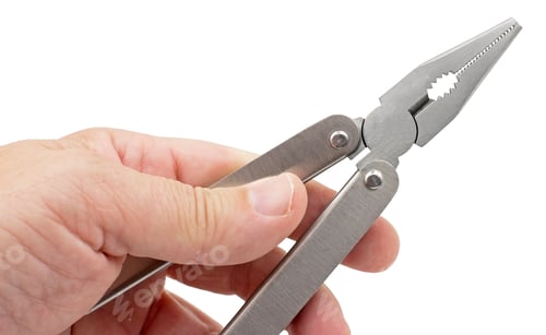 Preview: Hand Is Holding Universal Pliers On White Background