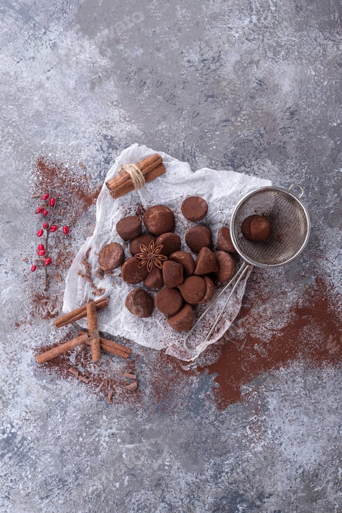 Preview: Home Made Chocolate Truffles On A Baking Paper Decorated With Strainer Cinnamon, Star Anise And